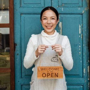 Offline Marketing Strategies for Small Businesses Boost Your Reach and Revenue Photo by Ketut Subiyanto: https://www.pexels.com/photo/ethnic-female-cafe-owner-showing-welcome-we-are-open-inscription-4473398/