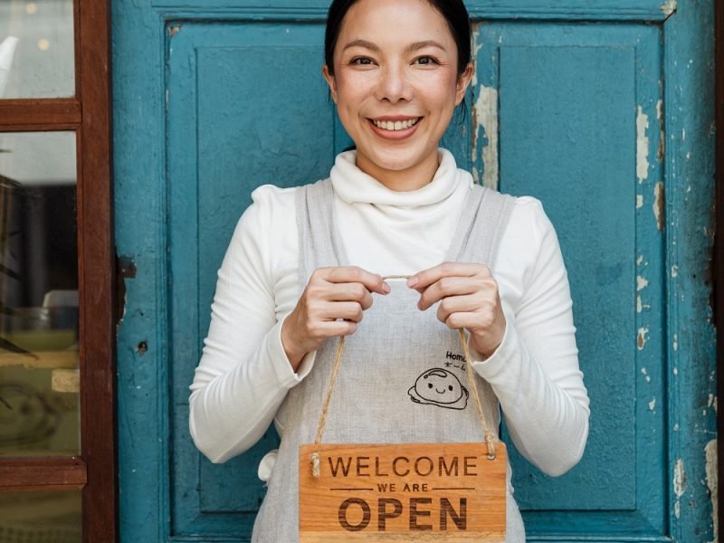 Offline Marketing Strategies for Small Businesses Boost Your Reach and Revenue Photo by Ketut Subiyanto: https://www.pexels.com/photo/ethnic-female-cafe-owner-showing-welcome-we-are-open-inscription-4473398/