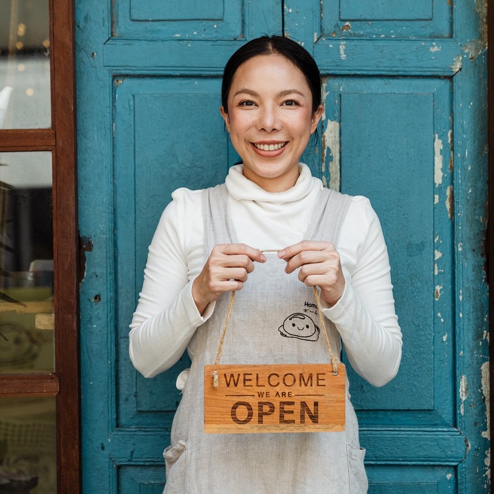 Offline Marketing Strategies for Small Businesses Boost Your Reach and Revenue Photo by Ketut Subiyanto: https://www.pexels.com/photo/ethnic-female-cafe-owner-showing-welcome-we-are-open-inscription-4473398/